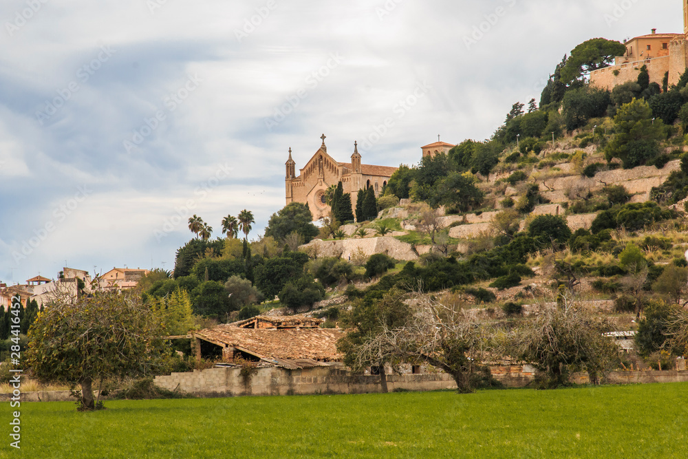 Spain, Balearic Islands, Mallorca, Arta. Parish Church of Transfiguracio del Senyor. As seen from valley below.