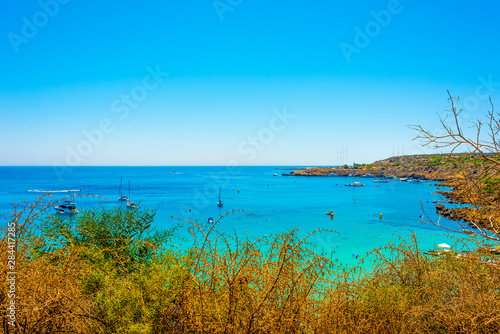  blue sea with clear water  mountains  yachts and the beach on the panorama of Konnos Bay Cyprus