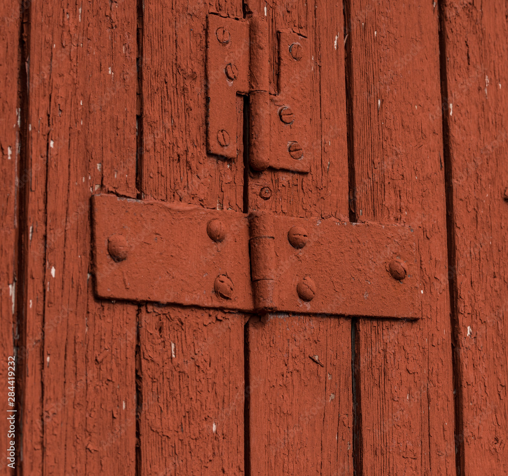 Hinges on a red barn door. Hinges on a red barn door.