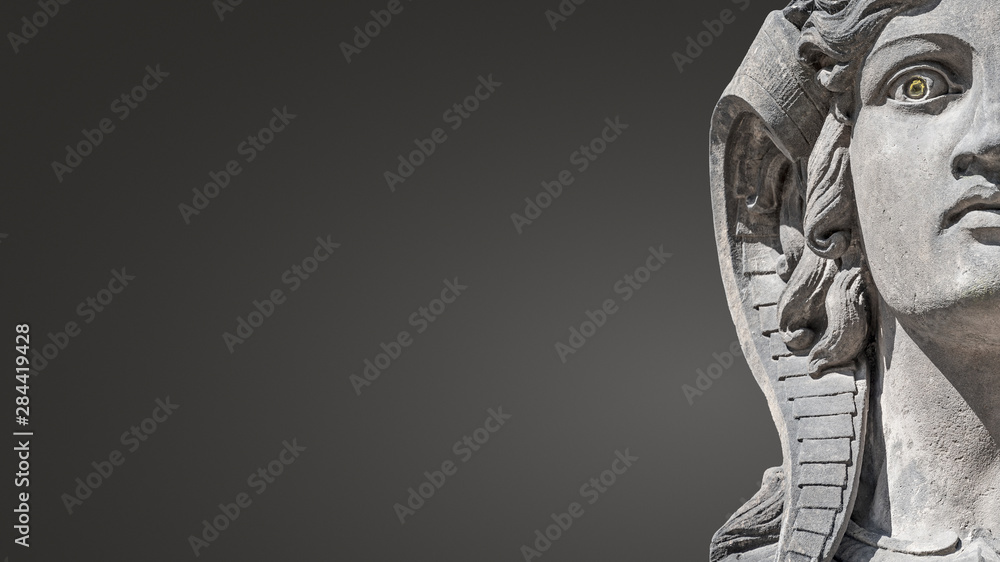 Face of beautiful and mystic Egyptian woman sphinx isolated at gradient smooth background with paste space at left side, portrait, details Face of beautiful and mystic Egyptian woman sphinx isolated at gradient smooth background with paste space at left side, portrait, details