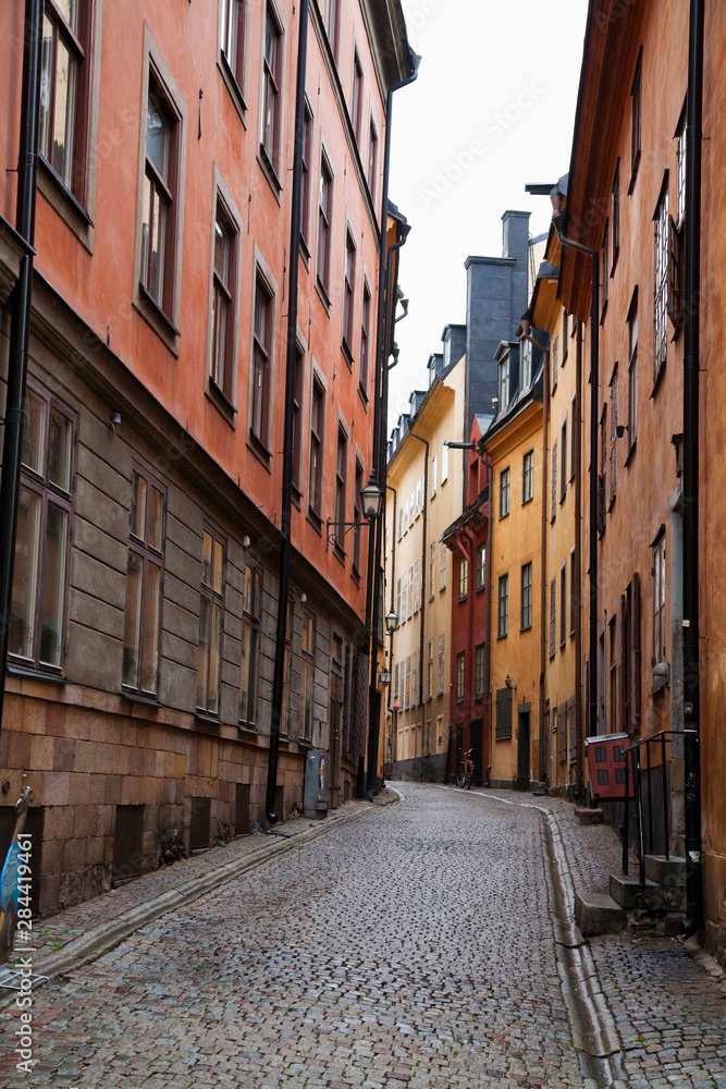 Stockholm, Sweden - A narrow alley going between two old world buildings.