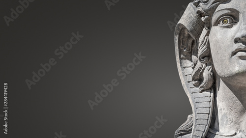 Face of beautiful and mystic Egyptian woman sphinx isolated at gradient smooth background with paste space at left side, portrait, details © neurobite