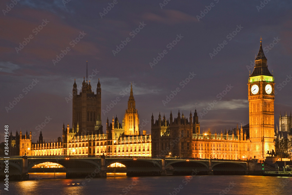 Great Britain, London. Big Ben and the Houses of Parliament are illuminated at night. 