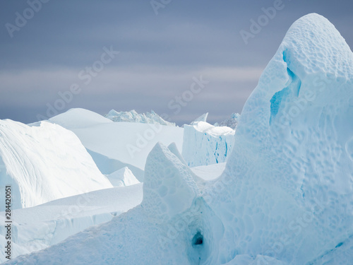 Ilulissat Icefjord also called kangia or Ilulissat Kangerlua at Disko Bay. The icefjord is listed as UNESCO World Heritage Site. photo