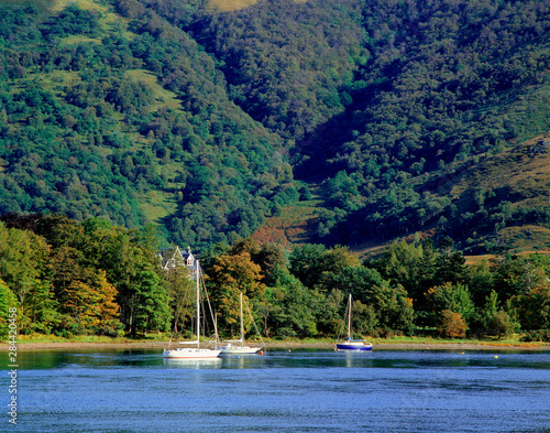 Scotland, Highland, Wester Ross, Onich. Sail boats are moored in Onich harbor on Loch Linnhe in the Highland of Scotland. photo