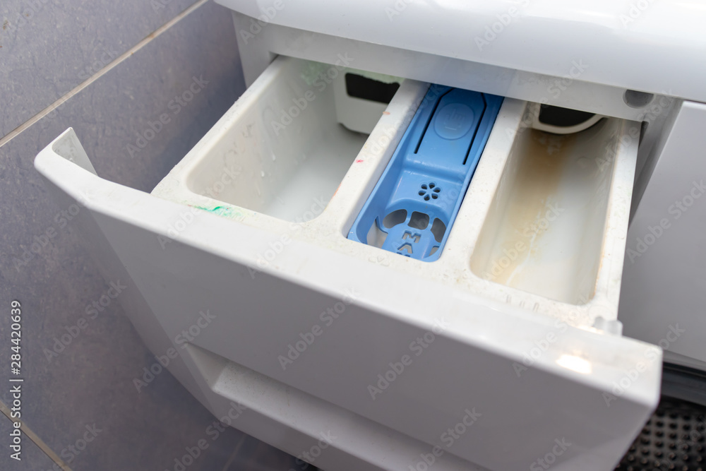 Dirty moldy washing machine detergent and fabric conditioner dispenser