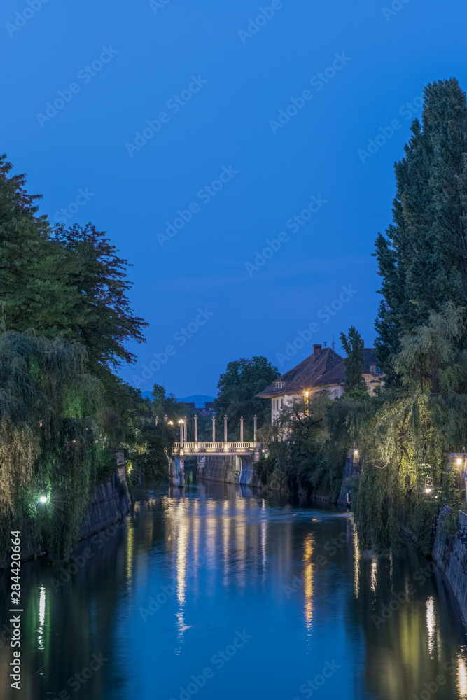Slovenia, Ljubljana, Ljubljana River and Cobbler's Bridge at Dawn