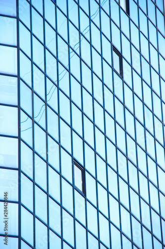 Wallpaper Mural A high-rise office building with blue glass windows Torontodigital.ca