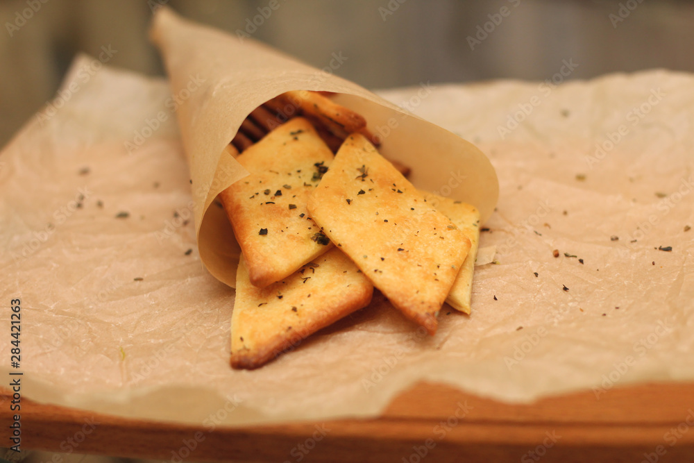 tasty crunchy diamond-shaped snack in a paper bag tasty crunchy diamond-shaped snack in a paper bag