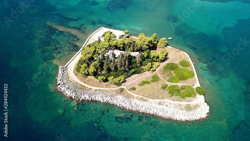 Aerial drone bird's eye view photo of iconic small island of Pontikonisi or Mouse island in area of Kanoni, Corfu island, Ionian, Greece
