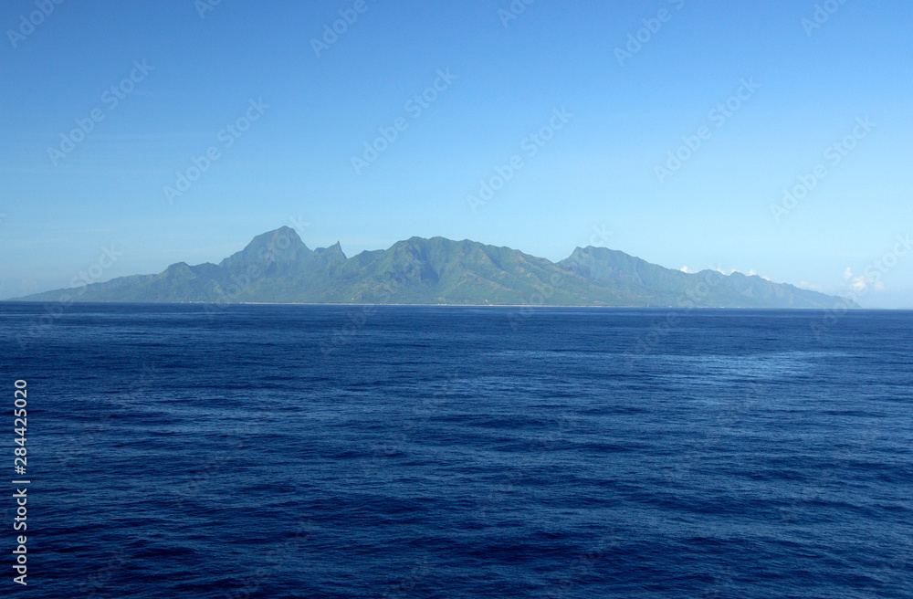 South Pacific, French Polynesia, Moorea. Distant view of Moorea from Papeete, Tahiti.