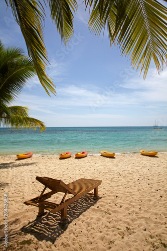 Beach, palm trees and lounger, Plantation Island Resort, Malolo Lailai Island, Mamanuca Islands, Fiji, South Pacific photo