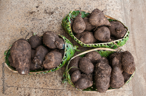 Sweet potato in wooden baskets in a souvenir market in Neiafu, Vava'u islands, Tonga, South Pacific photo