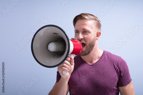 Beard Man Shouting Through A Megaphone