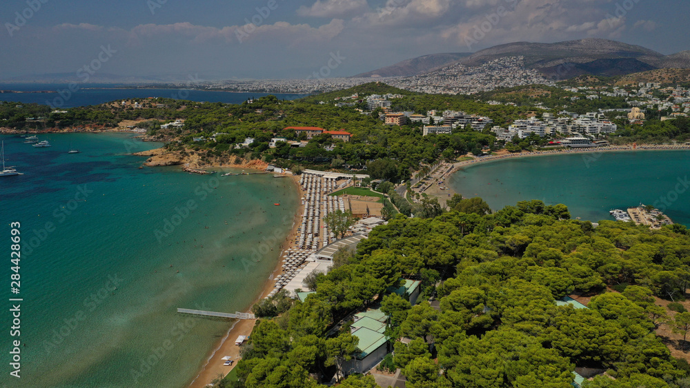 Aerial drone photo from famous Astir or Asteras sandy beach in south Athens riviera, Vouliagmeni Peninsula, Greece