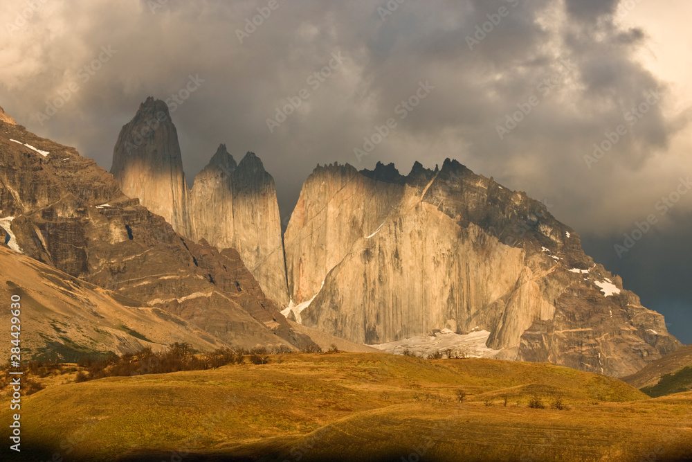 Chile, Torres del Paine National Park. Morning light bathes the Torres granite towers. 