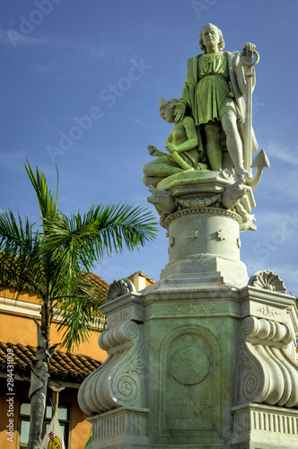 Great statue of Christopher Columbus looks out over the Plaza de la Aduana in the Old City, Ciudad Vieja, Cartagena, Colombia. photo