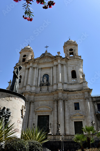 Facade of the baroque Catania church of Saint Francis of Assisi to the Immaculate with a monument to cardinal Dusmet in the foreground