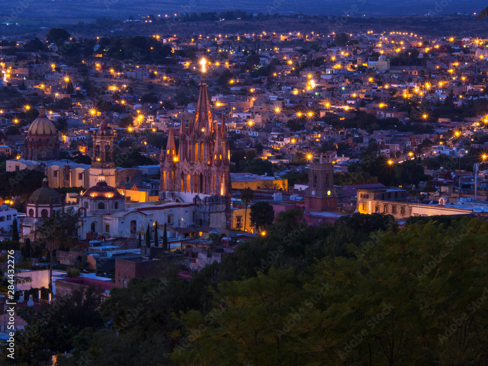 Mexico, San Miguel de Allende, Evening City View from above City with Parroquia Archangel Church