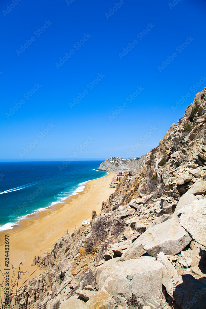 Cabo San Lucas, Baja California Sur, Mexico - A beach with a large rock formation.