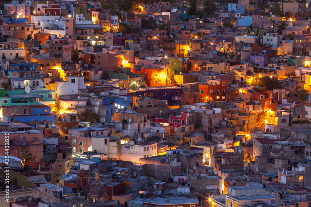 Obraz Mexico, Guanajuato. Street lights add ambience to this twilight village scene.