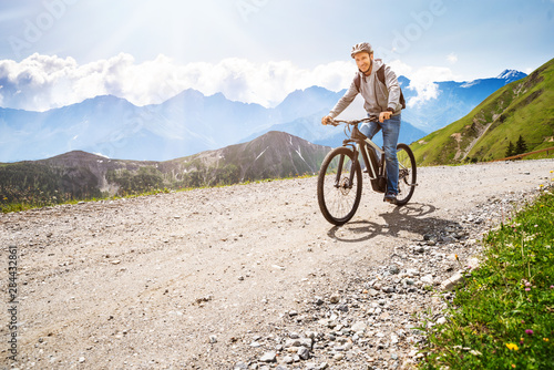 Fototapeta Naklejka Na Ścianę i Meble -  Man Riding Electric Mountain Bike