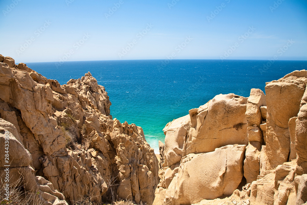 Cabo San Lucas, Baja California Sur, Mexico - View of the ocean with a large rock formation in the foreground.