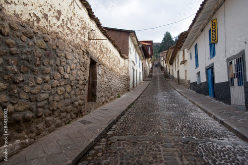 South America - Peru. Old and new building elements along cobblestone street in Cusco.
