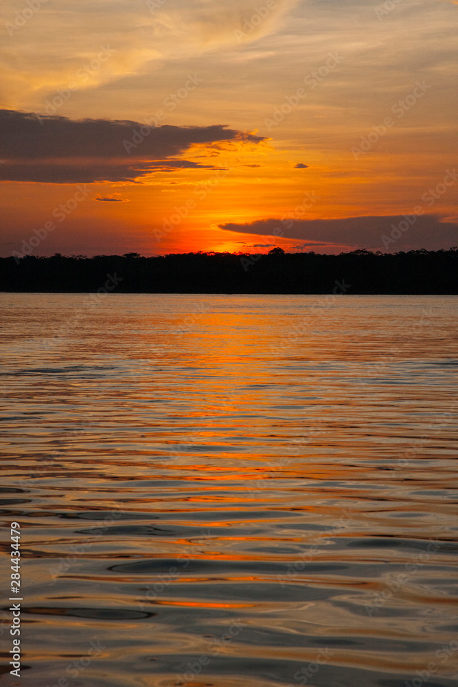 In the Amazon Basin of Peru, this is a sunset on the Ucayali River. In the Amazon Basin of Peru, this is a sunset on the Ucayali River.