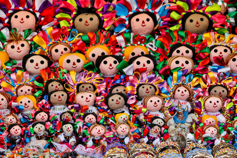 Guanajuato in Central Mexico. Vendor display colorful dolls for sale