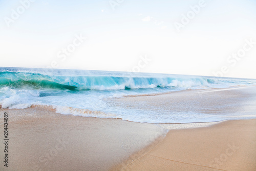 Fototapeta Naklejka Na Ścianę i Meble -  Cabo San Lucas, Baja California Sur, Mexico - Waves splashing onto a beach.