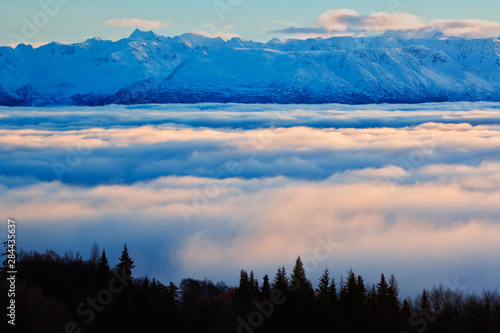 Kachemak Bay and Kenai Mountains during winter sunset from Homer, Alaska photo