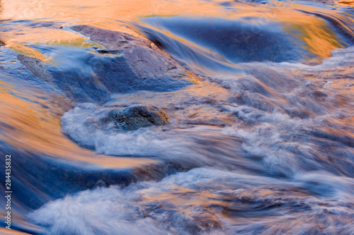 AZ, Arizona, Slide Rock State Park, Oak Creek, water pattern with reflected light from sandstone rock