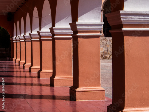 Mexico, Dolores Hidalgo, walk way with Arches of buildings photo