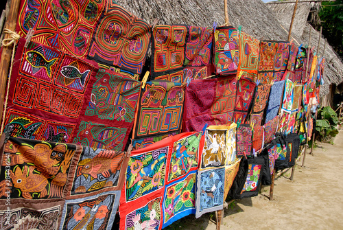 Central America, Panama, San Blas Islands (aka Kuna Yala). Colorful Kuna Indian hand stitched molas on display. photo