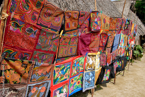 Central America, Panama, San Blas Islands (aka Kuna Yala). Colorful Kuna Indian hand stitched molas on display.