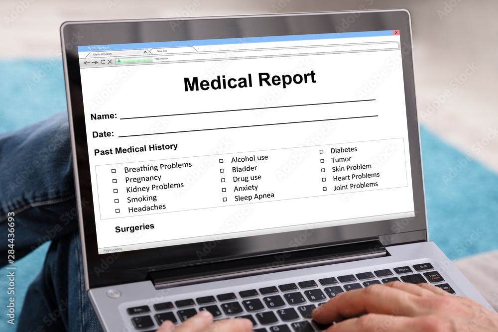 Person Analyzing Salary Survey Results On Laptop Person Analyzing Salary Survey Results On Laptop