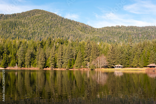 US, Alaska, Ketchikan. Ward Lake popular for picnic, fishing, walking. Picnic shelter near park entrance reflected