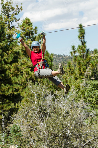 Zip lining Big Bear Lake, California. (MR).