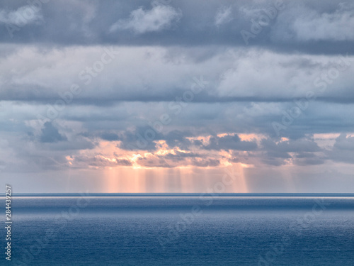 USA, California, San Diego. Sun's rays break through clouds over Pacific Ocean