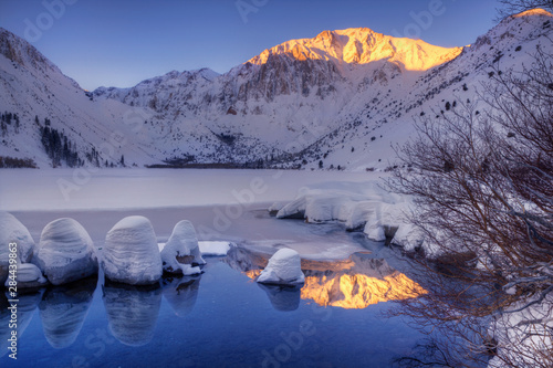 USA, California, Sierra Nevada Range. Winter sunrise at Convict Lake.  photo