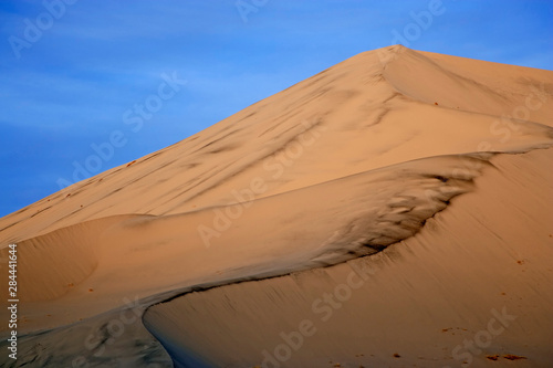 USA, California, Death Valley National Park, Eureka Sand Dunes. Close-up of smooth hill of sand. 