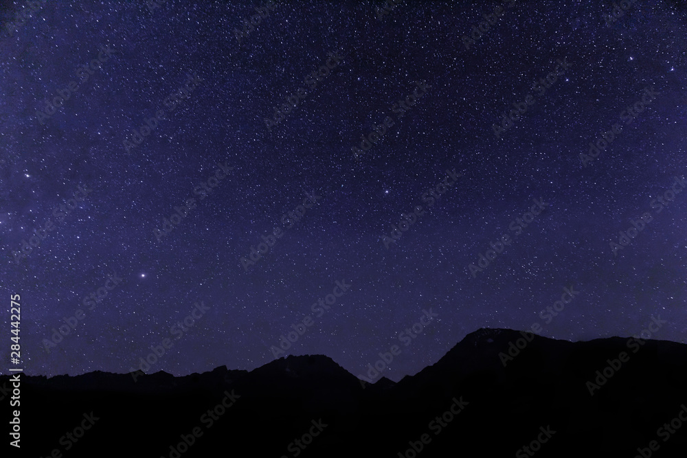 USA, California, Bishop. Star-filled night over mountains. 