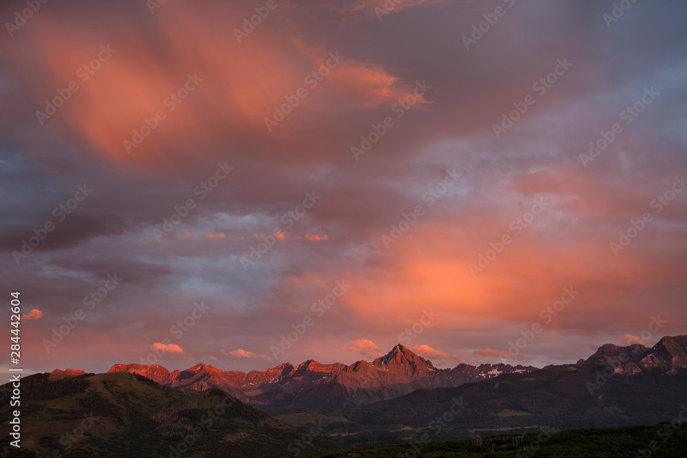 USA, Colorado, Sneffels Range. Rain clouds over mountains at sunset. 