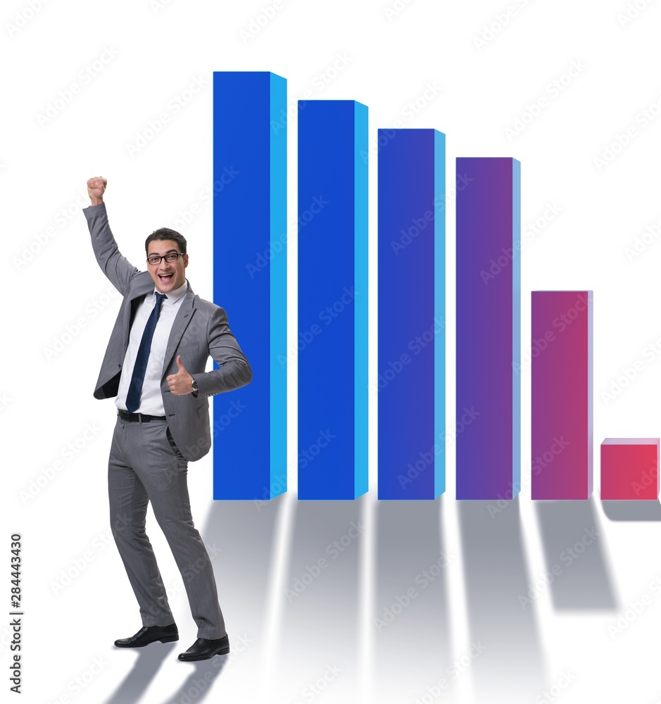 Young businessman in business concept with bar charts Young businessman in business concept with bar charts