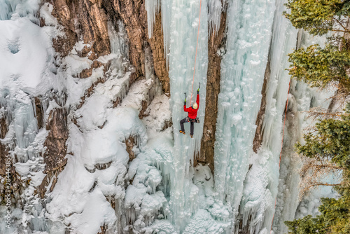 Ice climber ascending at Ouray Ice Park, Colorado photo