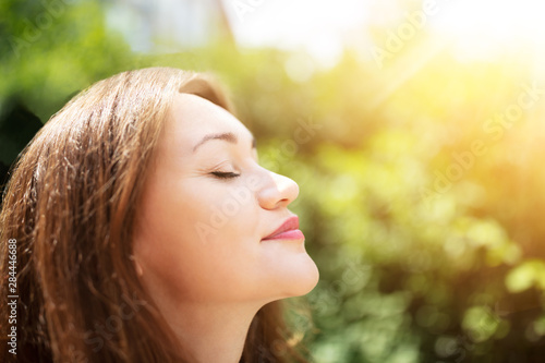 Young Woman Breathing Fresh Air