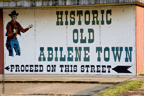 United States, Kansas, Abilene. A painted sign directs visitors to historic Old Abilene Town. photo