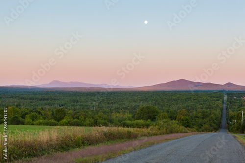 The moon over Mount Katahdin as seen from Townline Road (part of the International Appalachian Trail) in Merrill, Maine (near Smyrna Mills.) photo