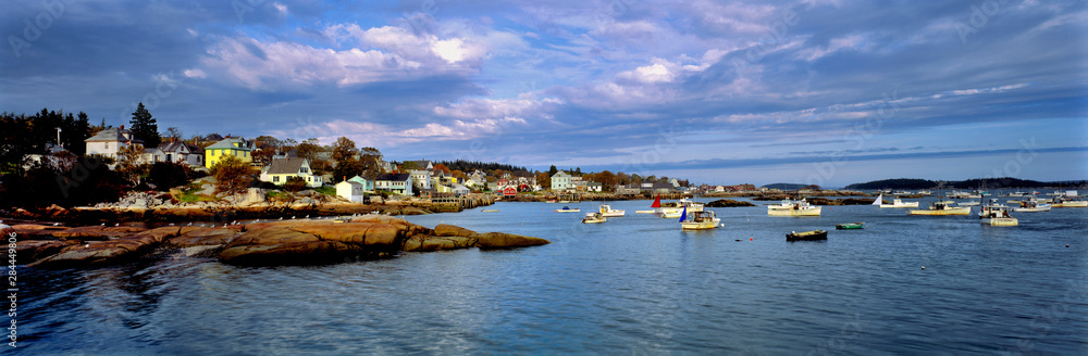 USA, Maine, Stonington. Blue-grey clouds sweep over the harbor of Stonington, Deer Island, Maine.